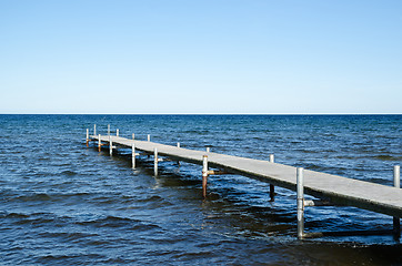 Image showing Wooden bath pier in blue water