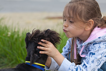 Image showing Little girl and her dog