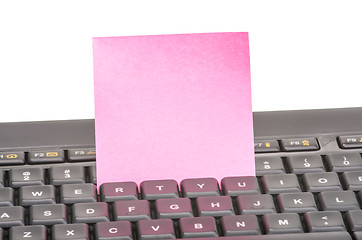 Image showing Paper note on keyboard