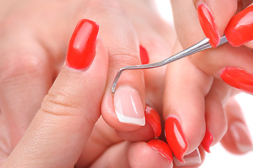 Image showing manicure applying - cleaning the cuticles 