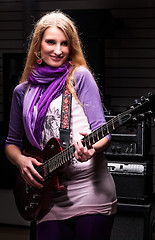 Image showing Attractive woman with  electric guitar