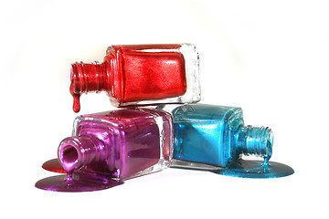 Image showing Stacked Fingernail Polish of Red Blue and Purple