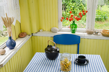 Image showing rural room and ceramic tea set calendula on table 