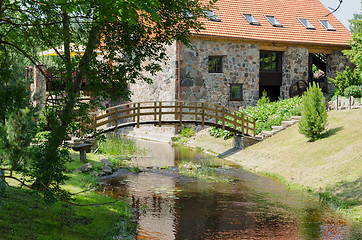 Image showing park with bridge over stream ancient brick manor 