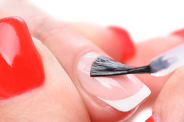 Image showing manicure, applying clear enamel