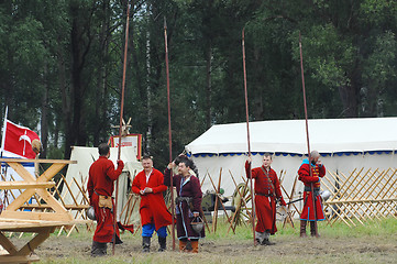 Image showing Hiking military detachment in  village 1572