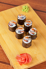 Image showing sushi rolls with tobico and pancake