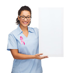 Image showing female doctor or nurse with white blank board