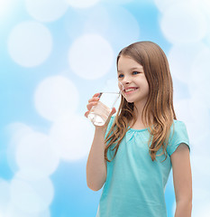 Image showing smiling little girl with glass of water