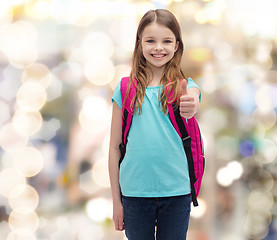 Image showing smiling girl with school bag showing thumbs up