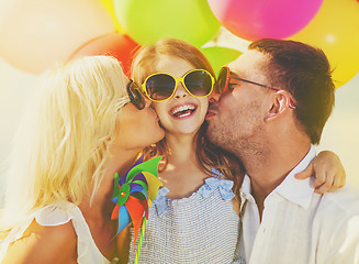 Image showing family with colorful balloons