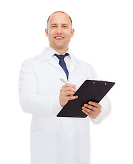 Image showing smiling male doctor with clipboard