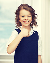 Image showing pre-teen girl showing thumbs up