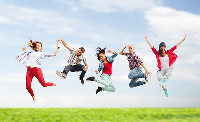 Image showing group of teenagers jumping