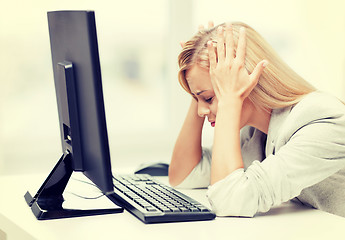 Image showing stressed woman with computer