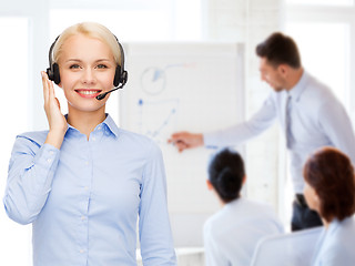 Image showing friendly female helpline operator