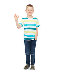 Image showing little boy in casual clothes showing OK gesture