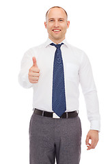 Image showing smiling businessman showing thumbs up