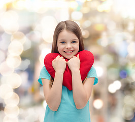 Image showing smiling little girl with red heart