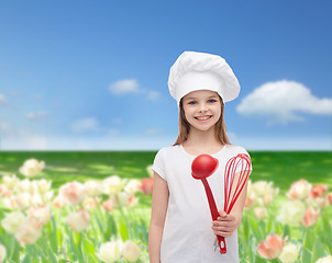 Image showing smiling girl in cook hat with ladle and whisk