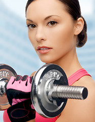 Image showing asian sporty woman with heavy dumbbell