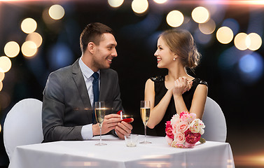 Image showing man proposing to his girlfriend at restaurant