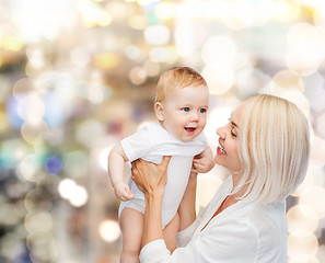 Image showing happy mother with smiling baby