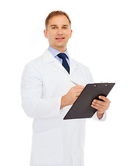 Image showing smiling male doctor with clipboard