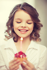 Image showing girl with cupcake