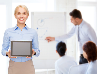 Image showing businesswoman with blank black tablet pc screen