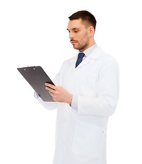 Image showing serious male doctor with clipboard