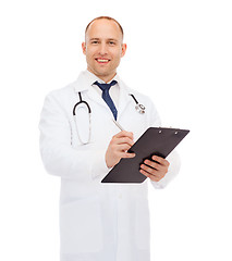 Image showing smiling male doctor with clipboard and stethoscope