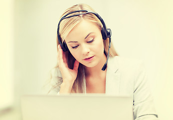 Image showing female helpline operator with laptop