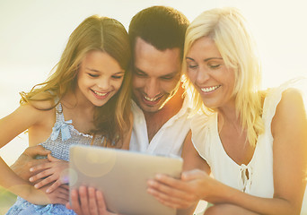 Image showing happy family with tablet pc taking picture