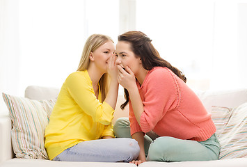 Image showing one girl telling another secret
