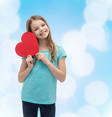 Image showing smiling little girl with red heart