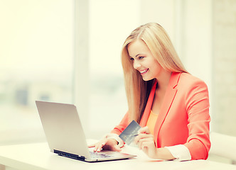 Image showing businesswoman with laptop and credit card