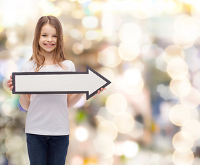 Image showing smiling girl with blank arrow pointing right