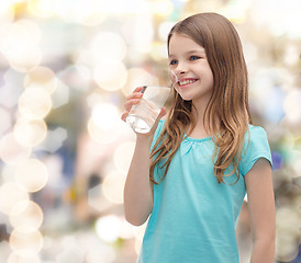 Image showing smiling little girl with glass of water