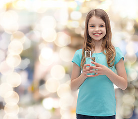 Image showing smiling little girl with glass of water