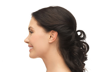 Image showing profile portrait of smiling young woman