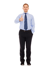 Image showing smiling businessman showing thumbs up