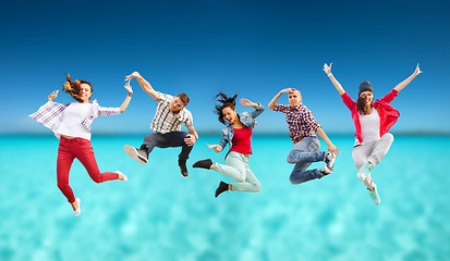 Image showing group of teenagers jumping