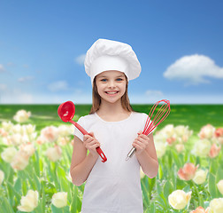 Image showing smiling girl in cook hat with ladle and whisk