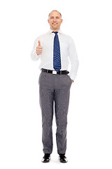 Image showing smiling businessman showing thumbs up