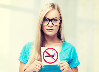 Image showing woman with smoking restriction sign