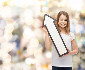 Image showing smiling little girl with blank arrow pointing up