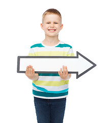 Image showing smiling little boy with blank arrow pointing right