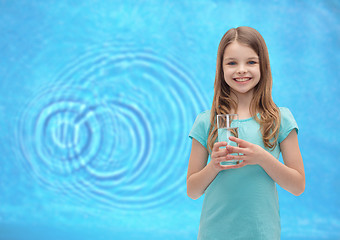 Image showing smiling little girl with glass of water