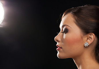 Image showing profile portrait of woman with diamond earrings